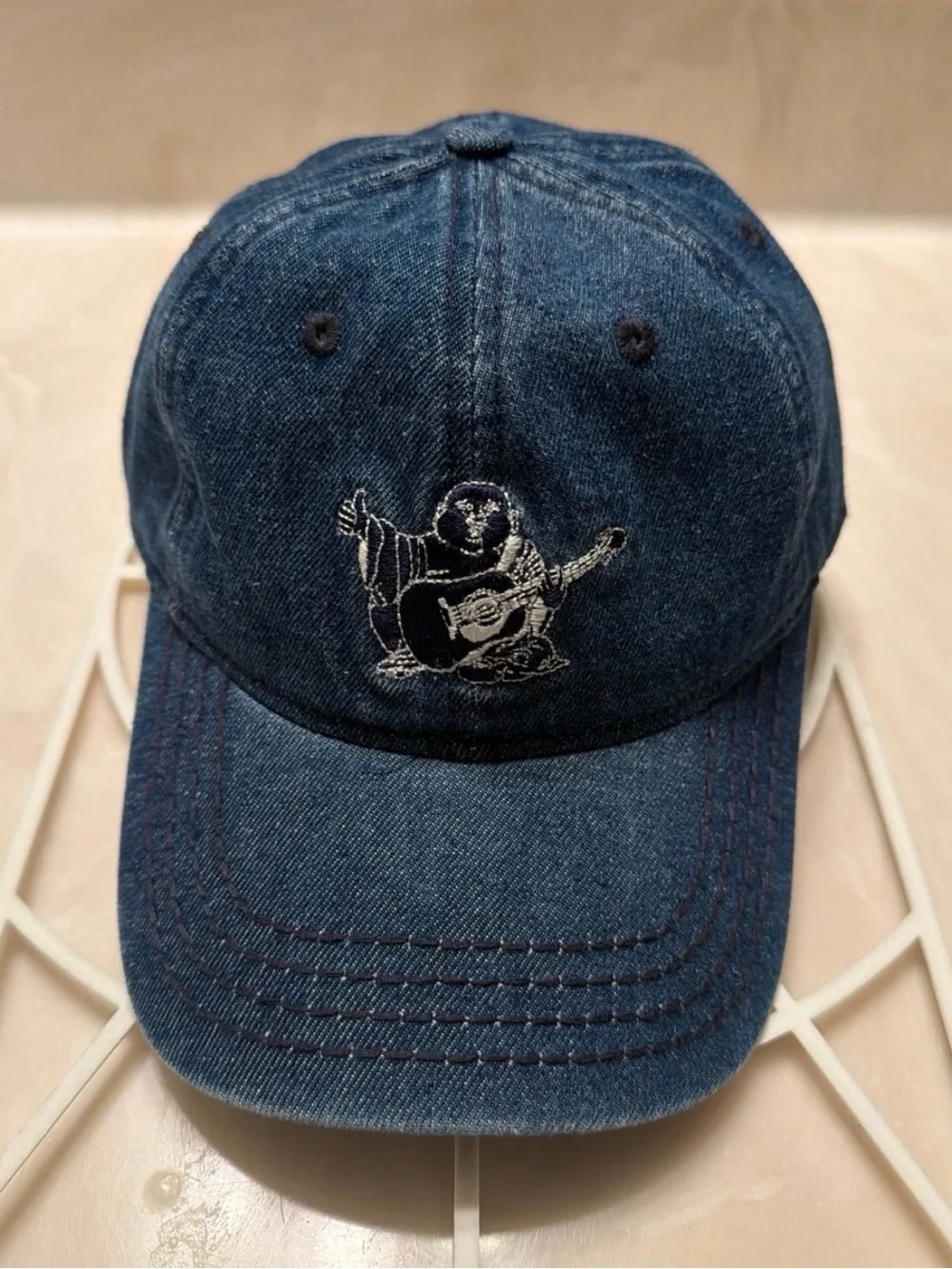 True Religion Blue Denim Baseball Cap with Embroidered Buddha Guitar